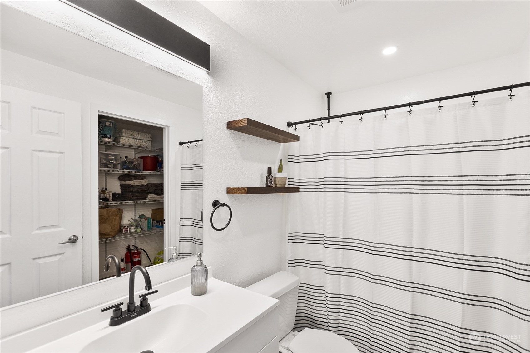 2097 Gull Way Camano Island, WA 98282 - Photo 15 of 35 a bathroom with a sink and a mirror