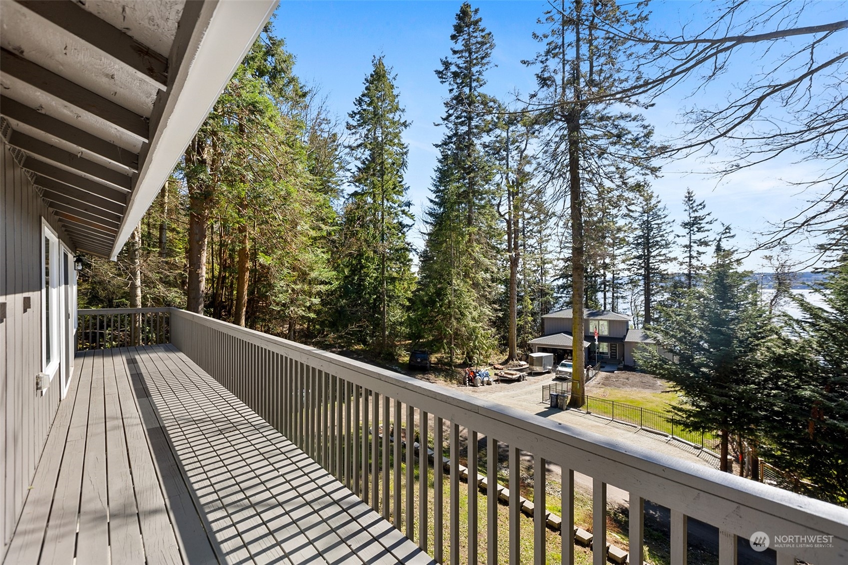 2097 Gull Way Camano Island, WA 98282 - Photo 2 of 35 a view of a balcony with wooden floor and fence