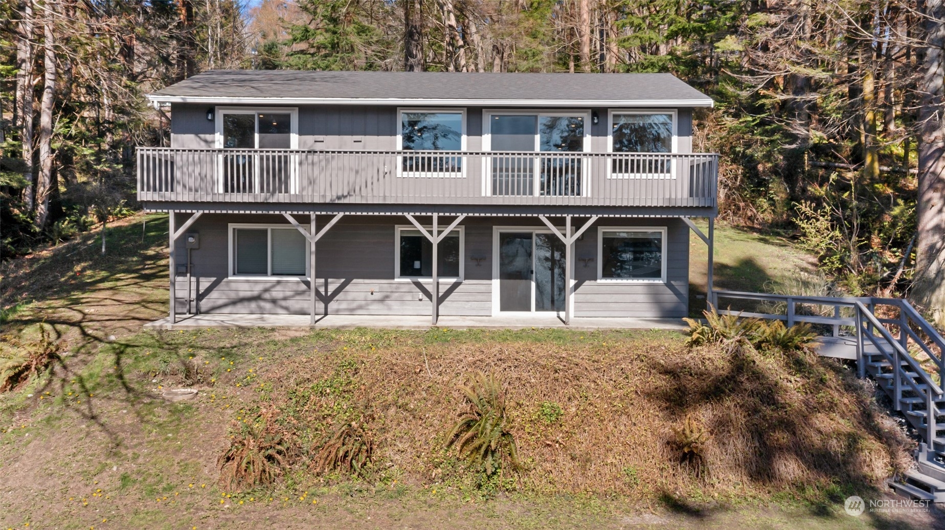 2097 Gull Way Camano Island, WA 98282 - Photo 21 of 35 a front view of a house with a yard