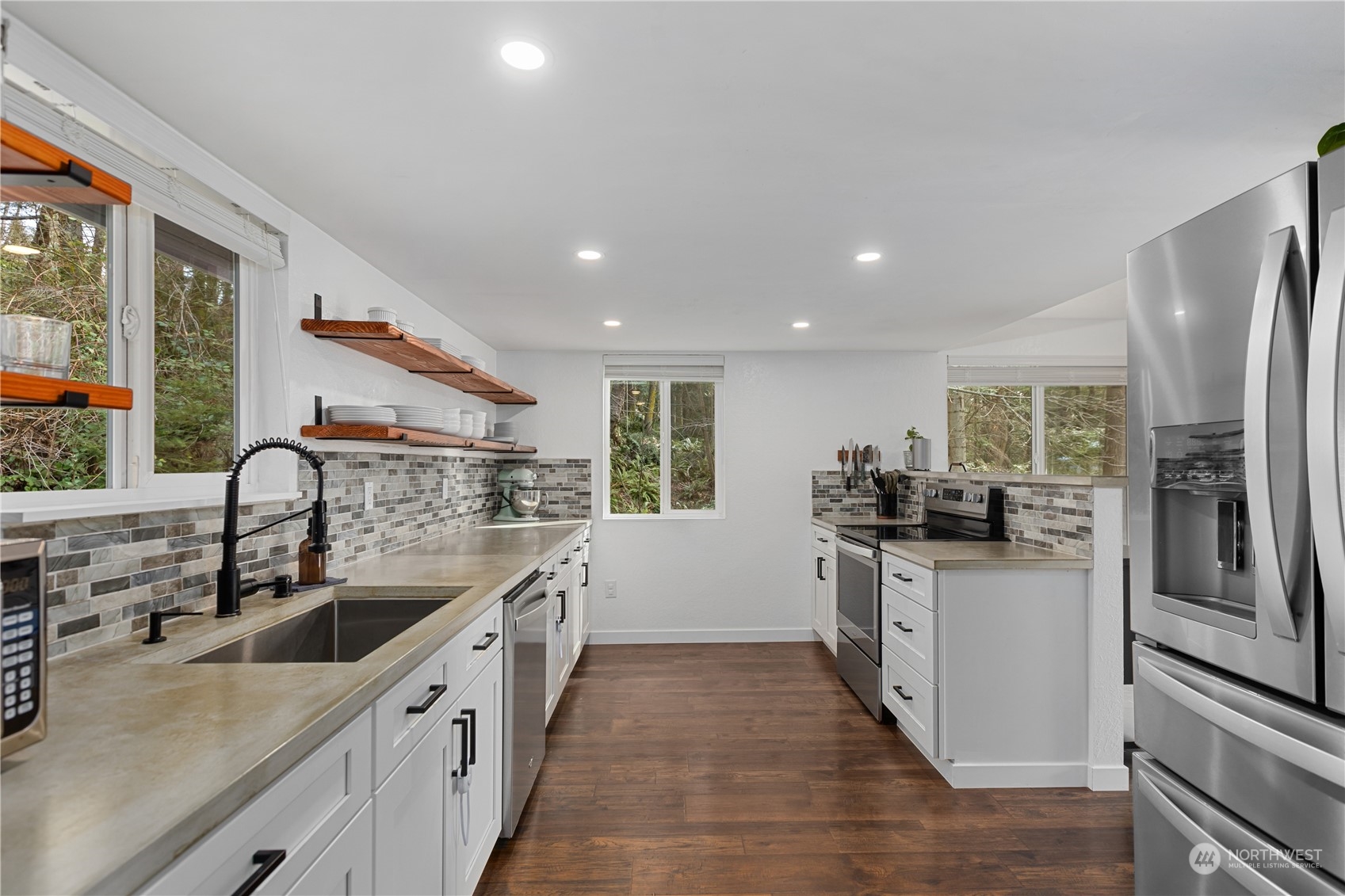 2097 Gull Way Camano Island, WA 98282 - Photo 3 of 35 a kitchen with stainless steel appliances granite countertop a sink stove and refrigerator