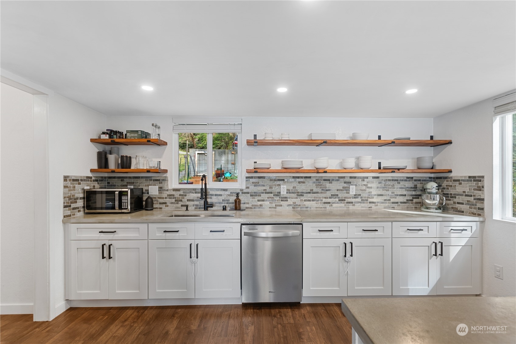 2097 Gull Way Camano Island, WA 98282 - Photo 7 of 35 a kitchen with granite countertop a white cabinets and sink