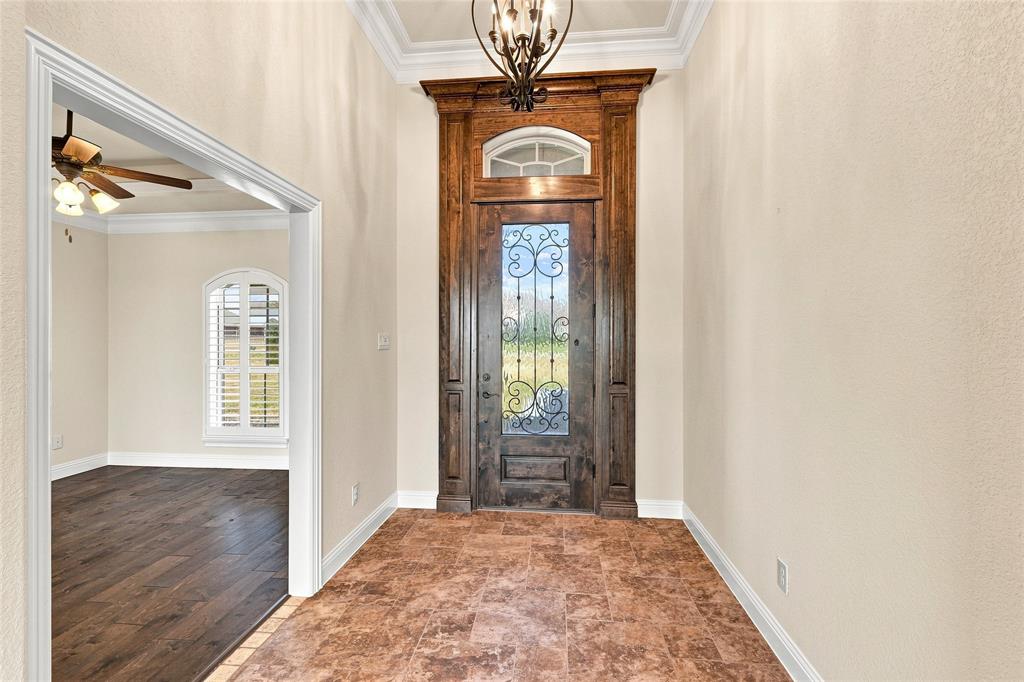 420 Hartley Way Azle, TX 76020 - Photo 3 of 40 Arched wood-finish entry door with decorative glass and transom window