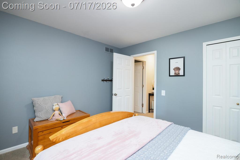 1648 North Kilburn Road Rochester, MI 48306 - Photo 23 of 41 Bedroom featuring light blue walls, white trim, and a flush mount ceiling light fixture- Pink room