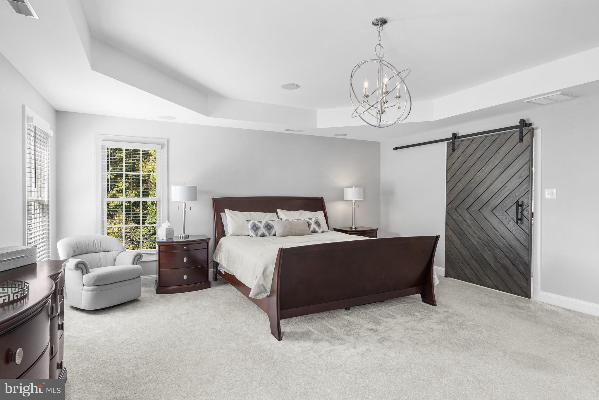 10205 Deep Skies Drive Laurel, MD 20723 - Photo 13 of 40 a spacious bedroom with a bed and window