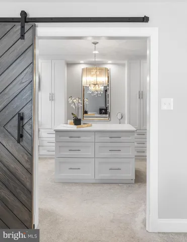 a spacious bedroom with a bed and window