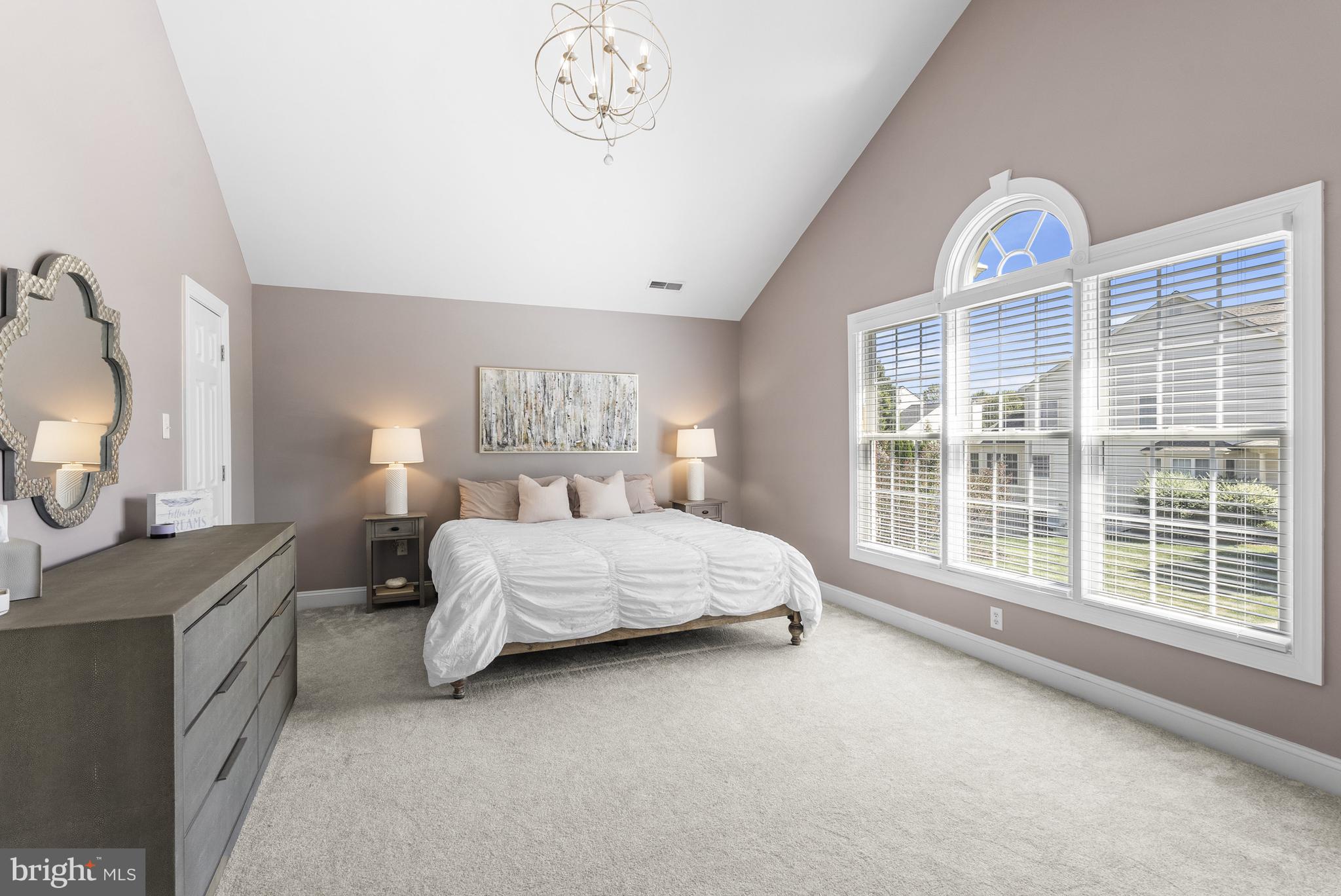 10205 Deep Skies Drive Laurel, MD 20723 - Photo 18 of 40 a bedroom with a large bed and a window