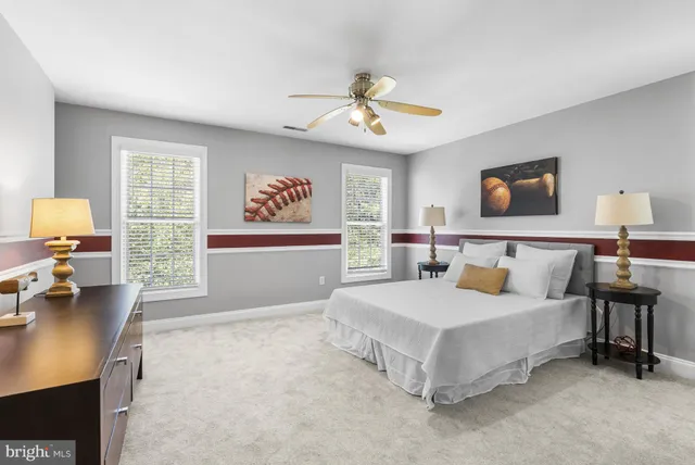 a bathroom with a sink toilet vanity and shower