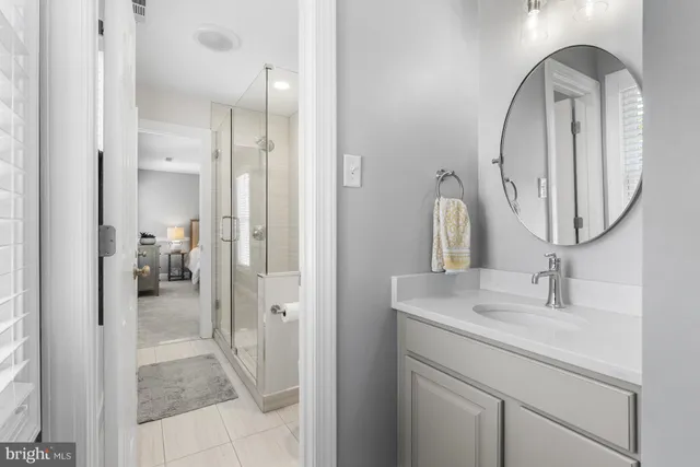 a bedroom with a bed and a desk