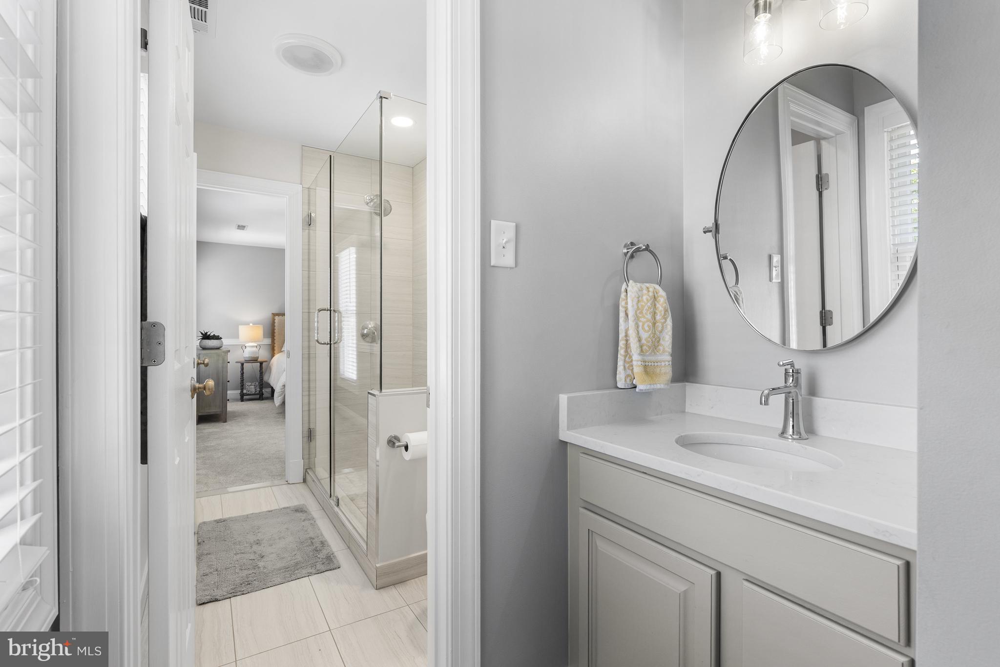 10205 Deep Skies Drive Laurel, MD 20723 - Photo 21 of 40 a en suite bathroom with a sink and a mirror
