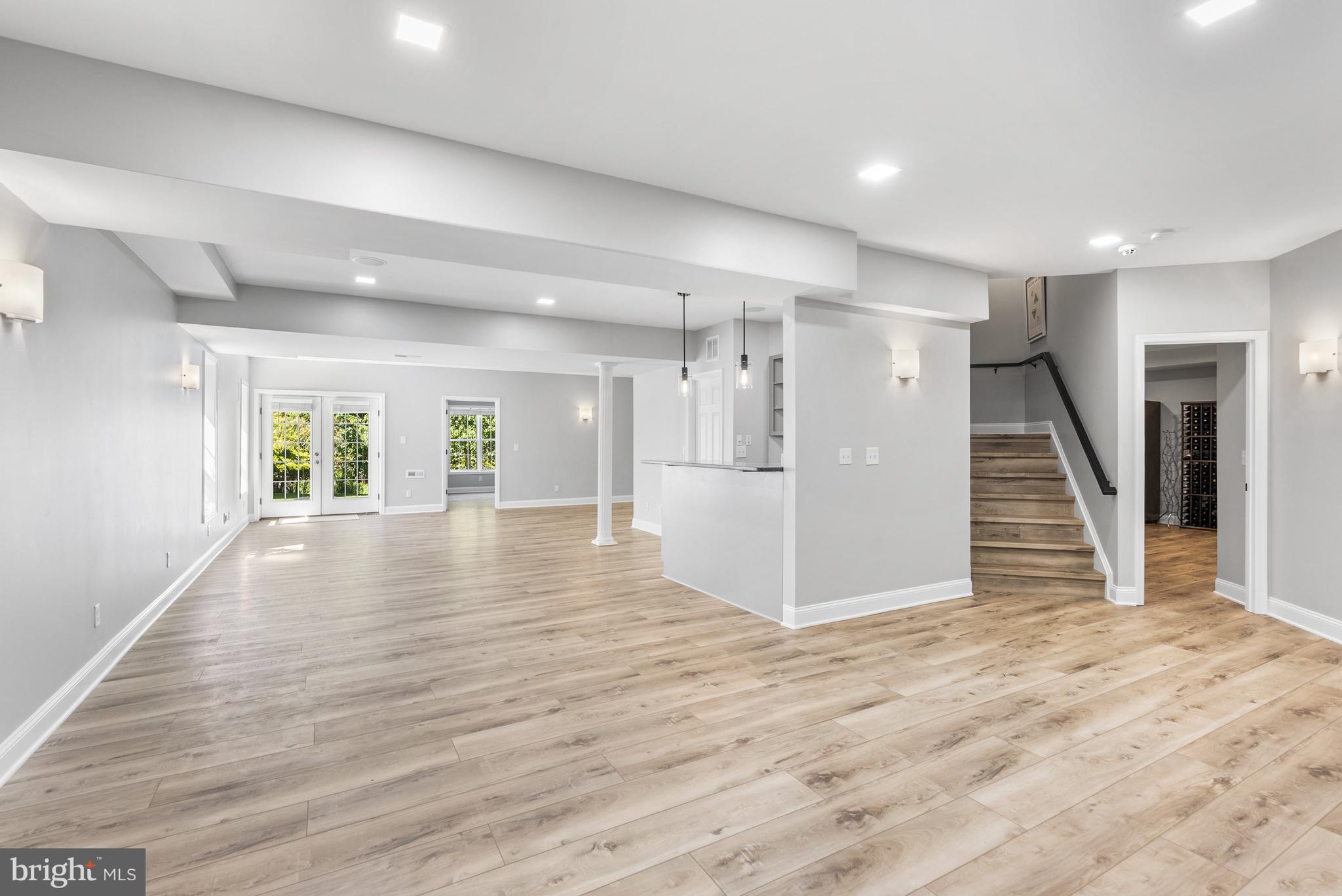 10205 Deep Skies Drive Laurel, MD 20723 - Photo 24 of 40 a view of a livingroom with wooden floor and staircase