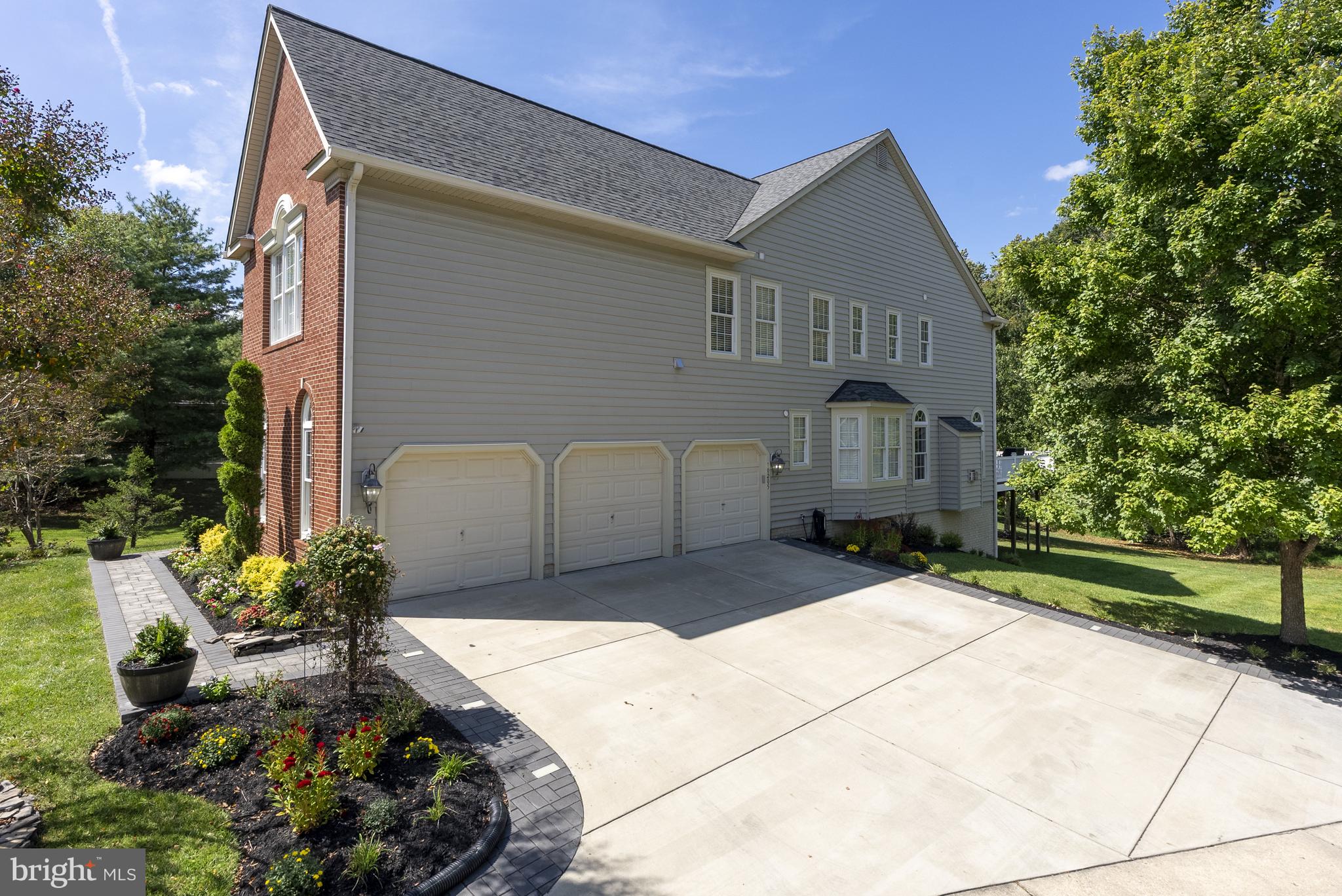 10205 Deep Skies Drive Laurel, MD 20723 - Photo 28 of 40 a front view of a house with a yard