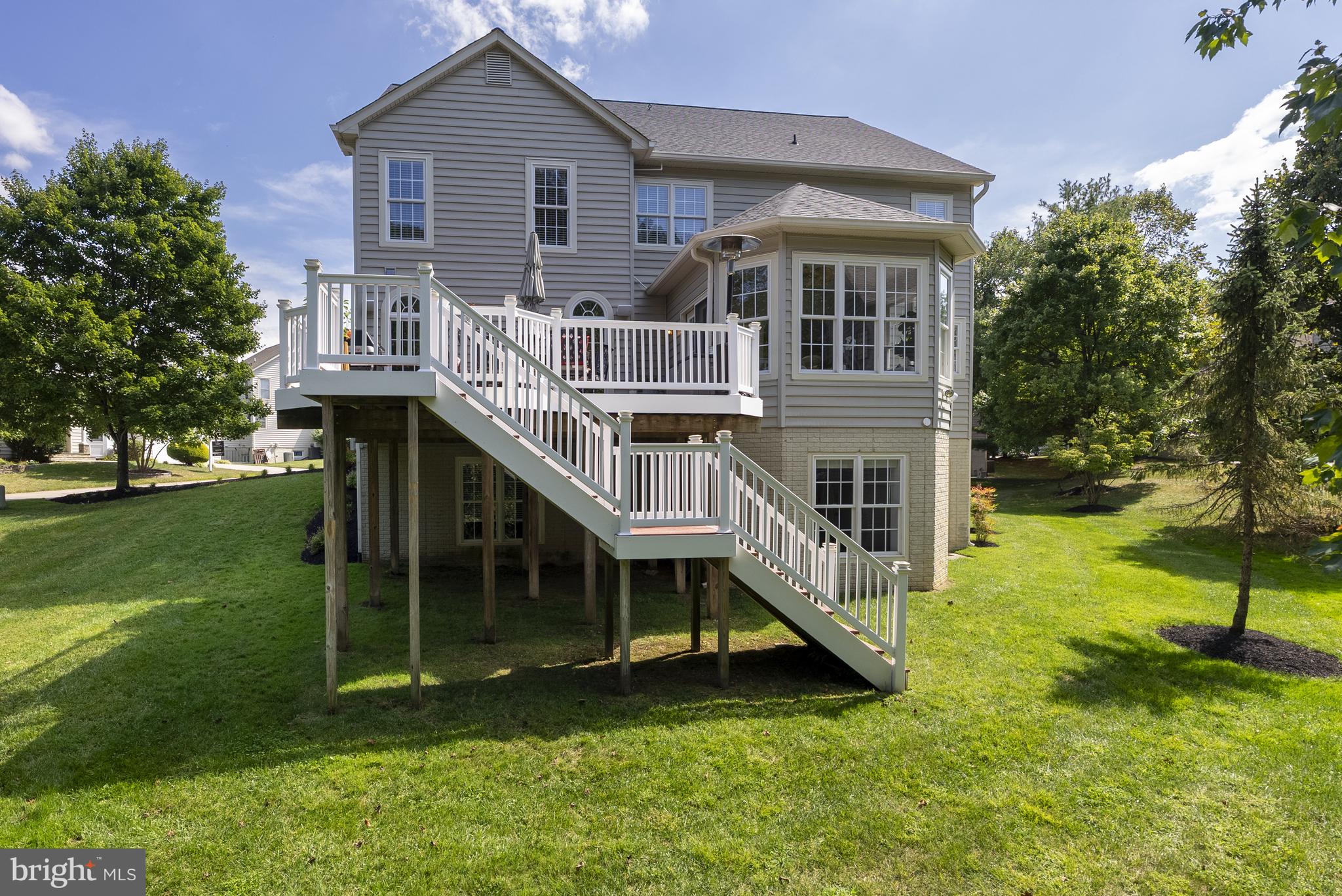 10205 Deep Skies Drive Laurel, MD 20723 - Photo 30 of 40 a view of house with a swimming pool and garden