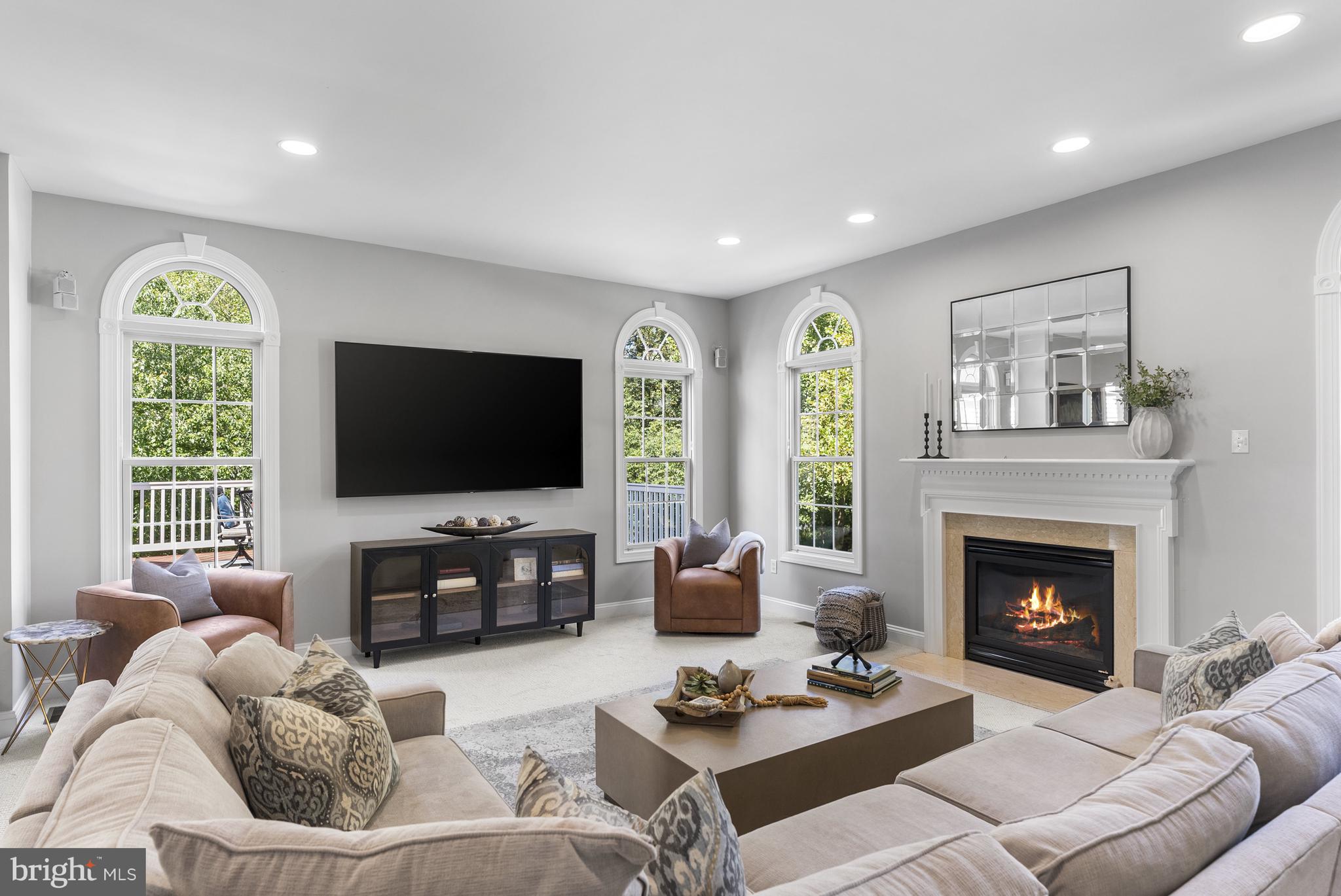 10205 Deep Skies Drive Laurel, MD 20723 - Photo 6 of 40 a living room with furniture a window and a flat screen tv