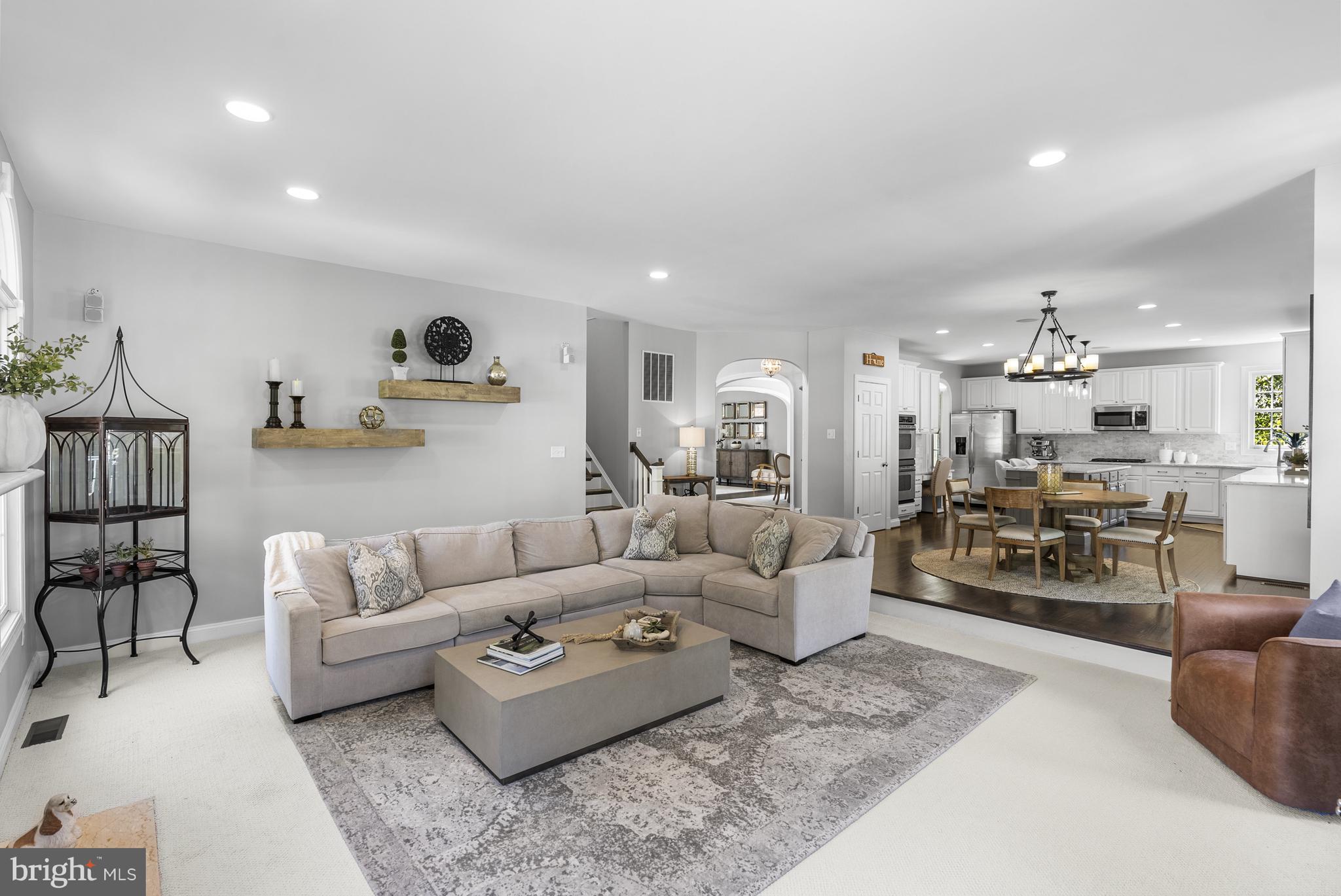 10205 Deep Skies Drive Laurel, MD 20723 - Photo 7 of 40 a living room with furniture and a wooden floor