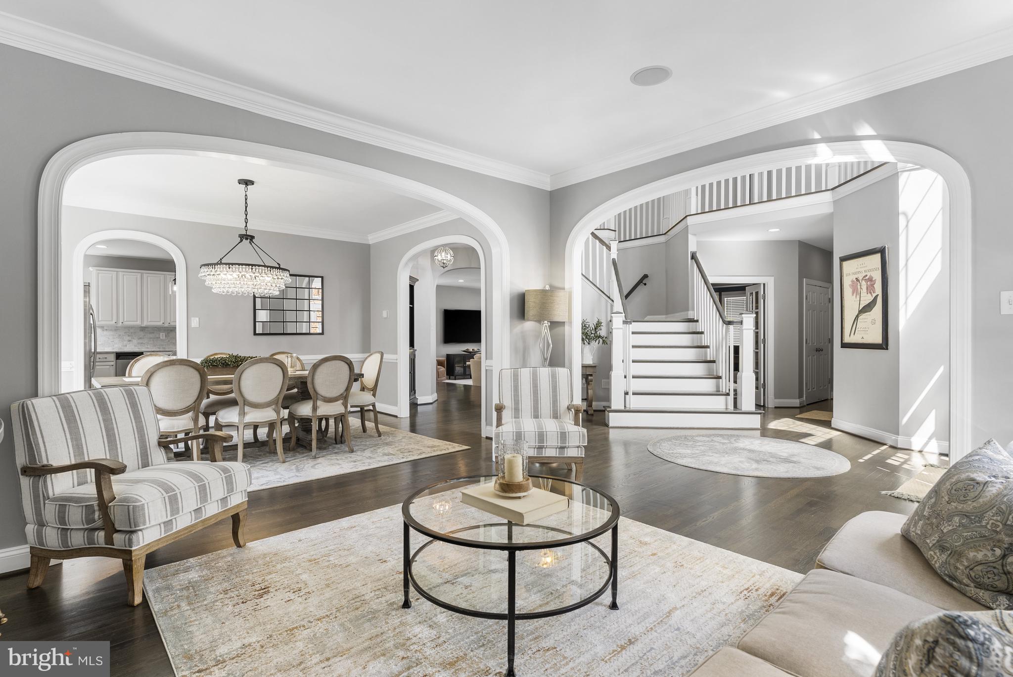10205 Deep Skies Drive Laurel, MD 20723 - Photo 9 of 40 a living room with furniture and a chandelier