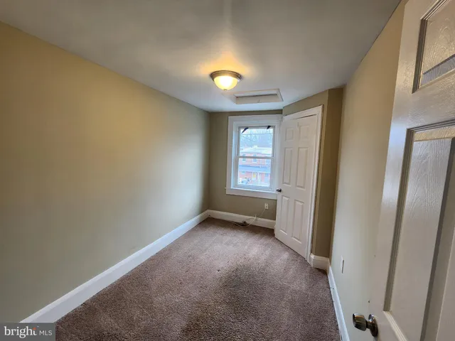 a view of empty room with windows