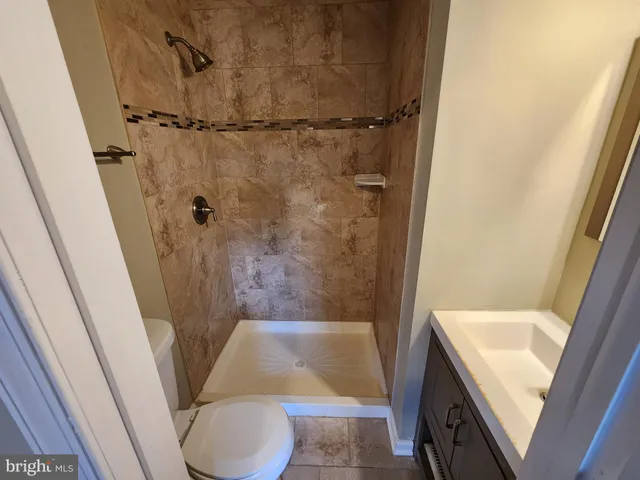 a bathroom with a sink and toilet
