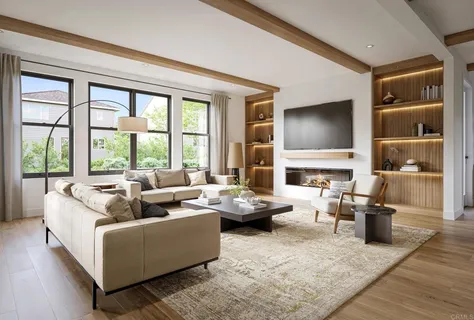 a living room with fireplace furniture and a large window