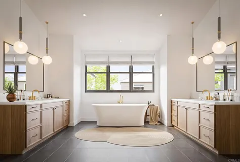 a very nice looking room with a large window and chandelier