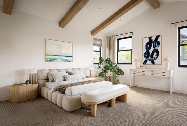 a living room with furniture and paintings on the wall