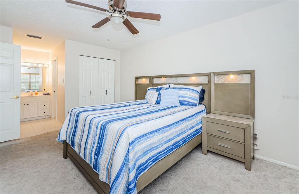 3716 Trophy Boulevard, Unit 3716 New Port Richey, FL 34655 - Photo 11 of 56 a bedroom with a bed and closet