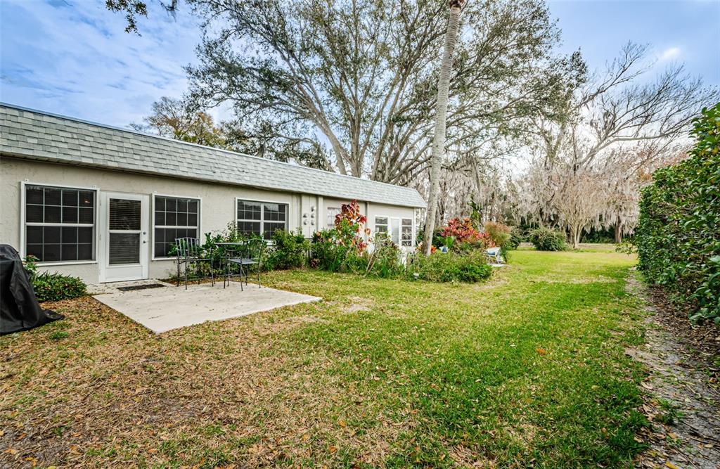 3716 Trophy Boulevard, Unit 3716 New Port Richey, FL 34655 - Photo 19 of 56 a view of a house with yard and plants