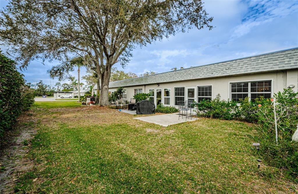 3716 Trophy Boulevard, Unit 3716 New Port Richey, FL 34655 - Photo 20 of 56 a view of a house with a yard