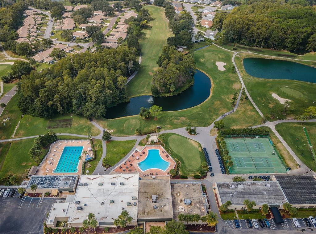 3716 Trophy Boulevard, Unit 3716 New Port Richey, FL 34655 - Photo 26 of 56 an aerial view of houses with swimming pool