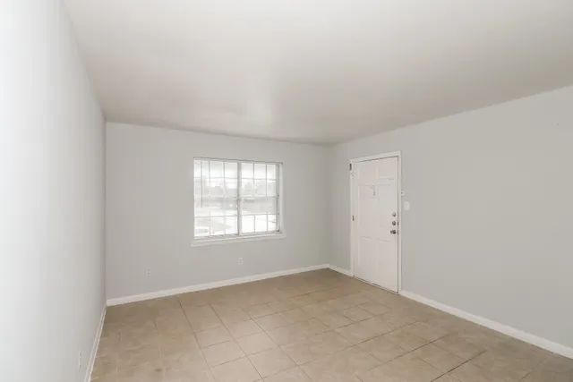 an empty room with windows