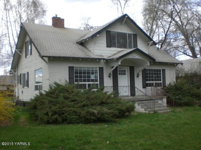 2906 Wiley Road Yakima, WA 98903 - Photo 1 of 27 a front view of a house with a yard and garage
