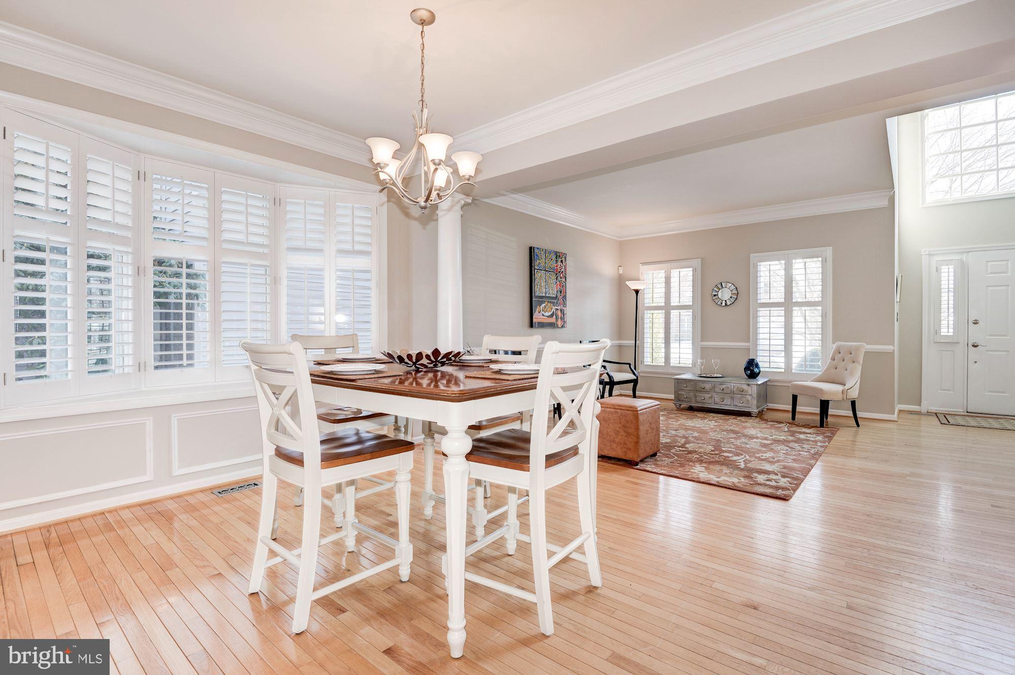 1326 Murray Downs Way Reston, VA 20194 - Photo 5 of 41 a view of a dining room with furniture window and wooden floor