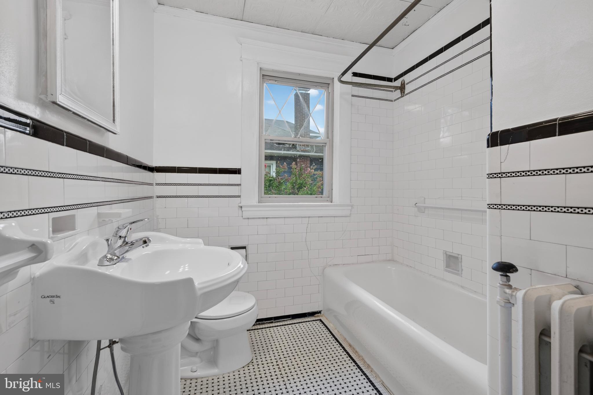 15 Overbrook Road Baltimore, MD 21228 - Photo 35 of 47 Full hall bath on 2nd level. Vintage tile