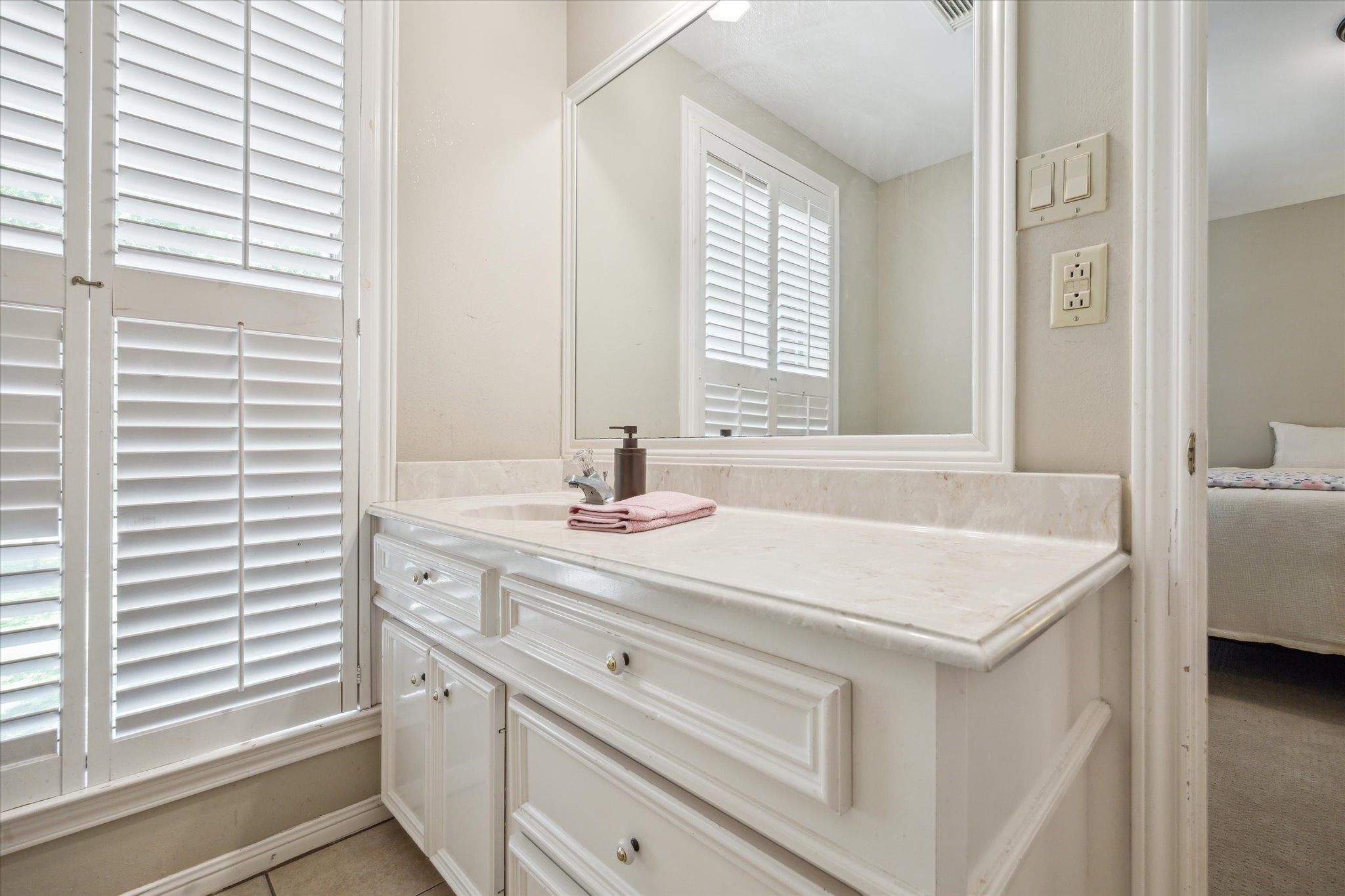 491 Oak Forest Road Bellville, TX 77418 - Photo 21 of 33 a bathroom with a sink and a window