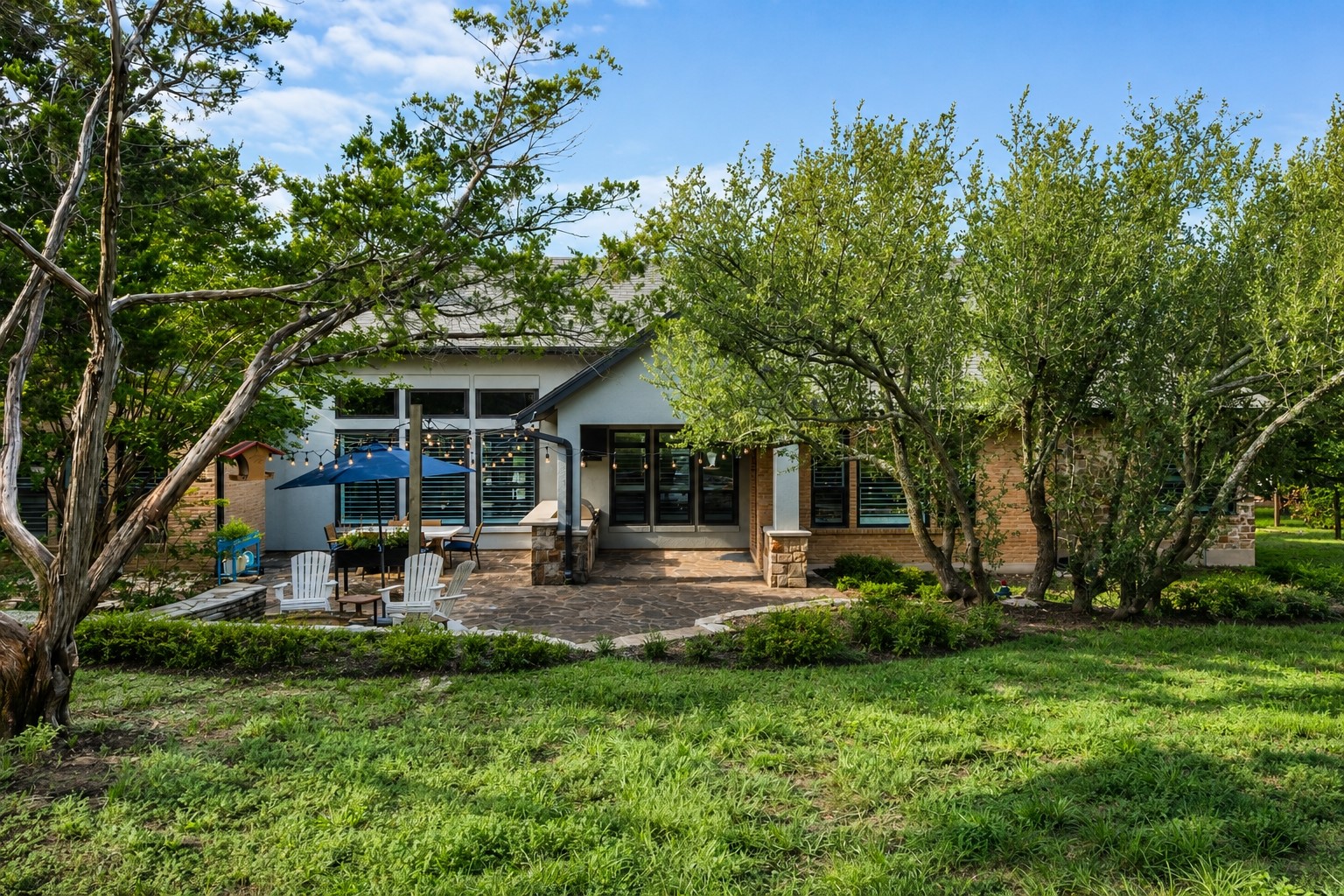 279 Rugged Earth Drive Austin, TX 78737 - Photo 37 of 40 a view of a house with backyard porch and sitting area