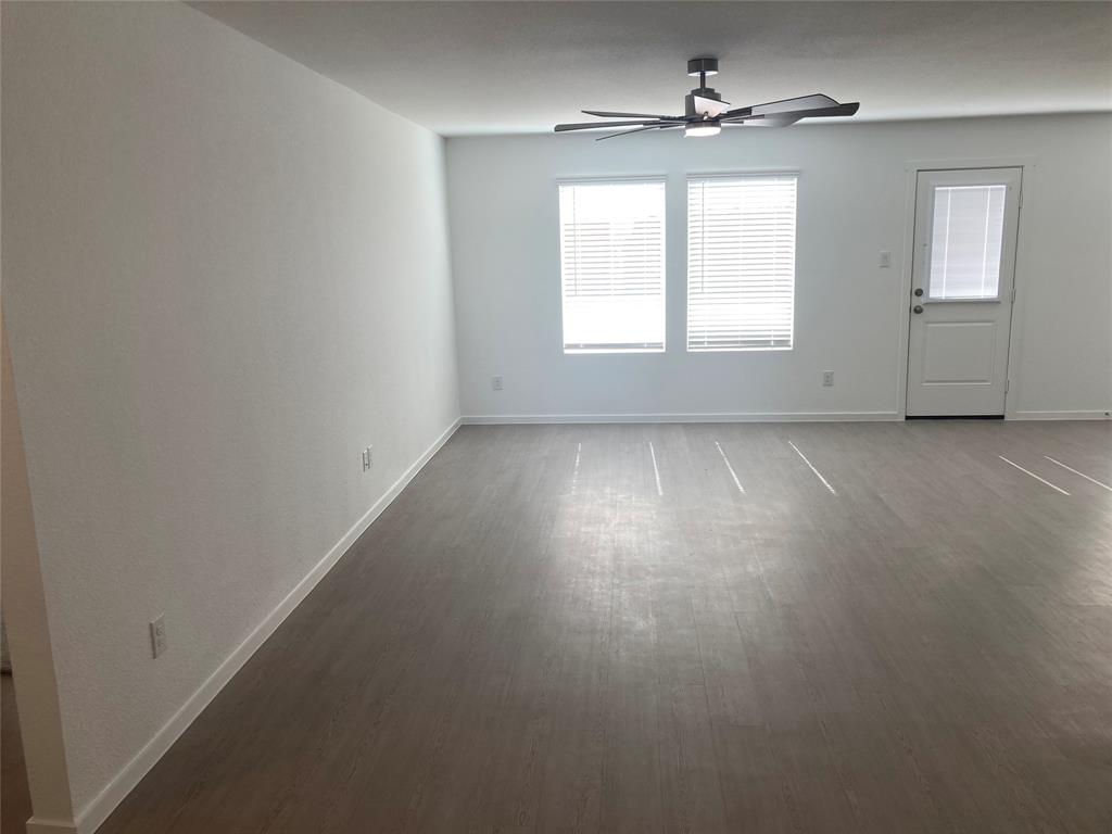 1520 Elliott Road Howe, TX 75459 - Photo 13 of 29 an empty room with windows and cabinet