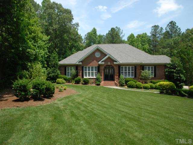 1005 Farnsworth Road Wake Forest, NC 27587 - Photo 1 of 25 Beautiful custom home on 2.28-acre cul-de-sac lot, gorgeous hdwds w/decorative inlay, floor to ceiling stone frpl w/gas logs in fam rms, custom built-ins, granite counter tops, SS appliances, master retreat w/trey ceiling.