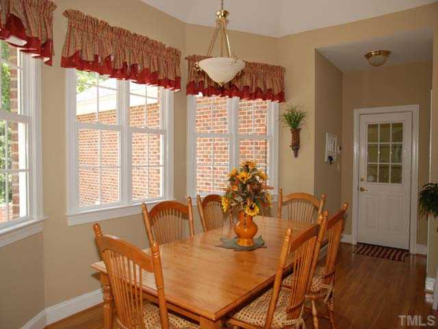 1005 Farnsworth Road Wake Forest, NC 27587 - Photo 11 of 25 The open breakfast nook is flooded with natural light and charm and overlooks the beautiful backyard.