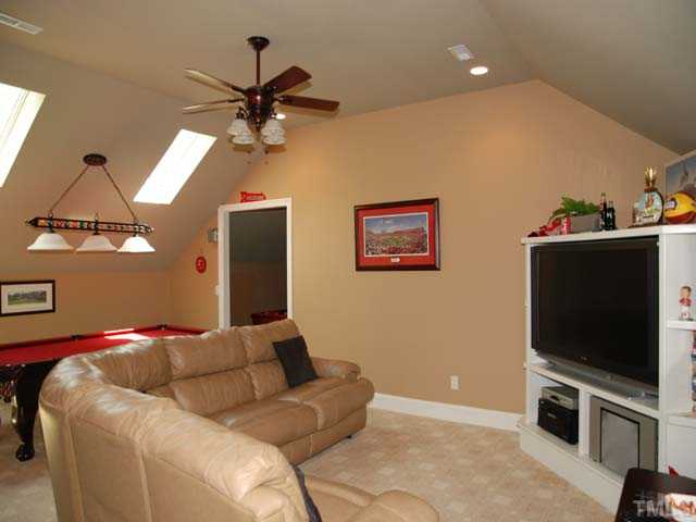 1005 Farnsworth Road Wake Forest, NC 27587 - Photo 14 of 25 The terrific bonus room with game area has skylights and a built in entertainment center.