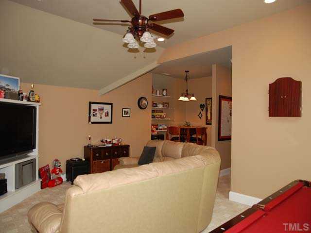 1005 Farnsworth Road Wake Forest, NC 27587 - Photo 15 of 25 The terrific bonus room with game area has skylights and a built in entertainment center.
