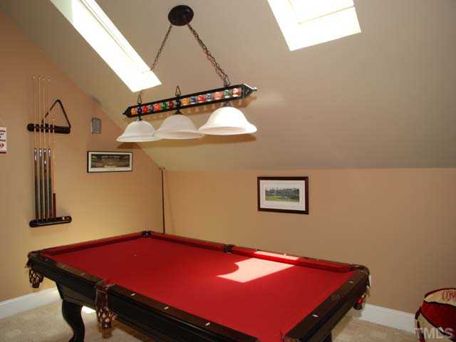 1005 Farnsworth Road Wake Forest, NC 27587 - Photo 16 of 25 The terrific bonus room with game area has skylights and a built in entertainment center.