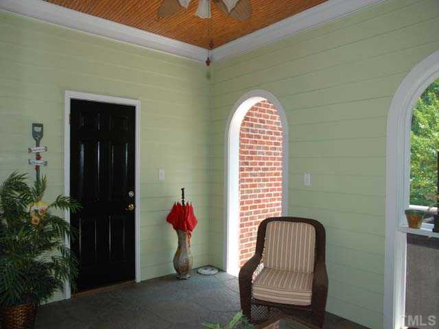 1005 Farnsworth Road Wake Forest, NC 27587 - Photo 18 of 25 The charming breezeway is an adorable covered sitting area with ceiling fan.