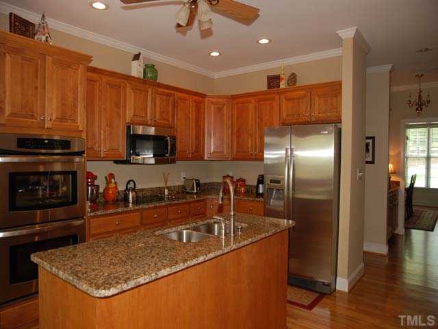 1005 Farnsworth Road Wake Forest, NC 27587 - Photo 8 of 25 The dueal ovens, built in microwave and smooth cook surface makes cooking a pleasure.