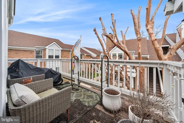 a view of a chairs and table on the deck