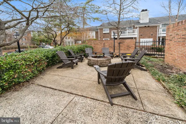 a view of a patio with table and chairs and potted plants
