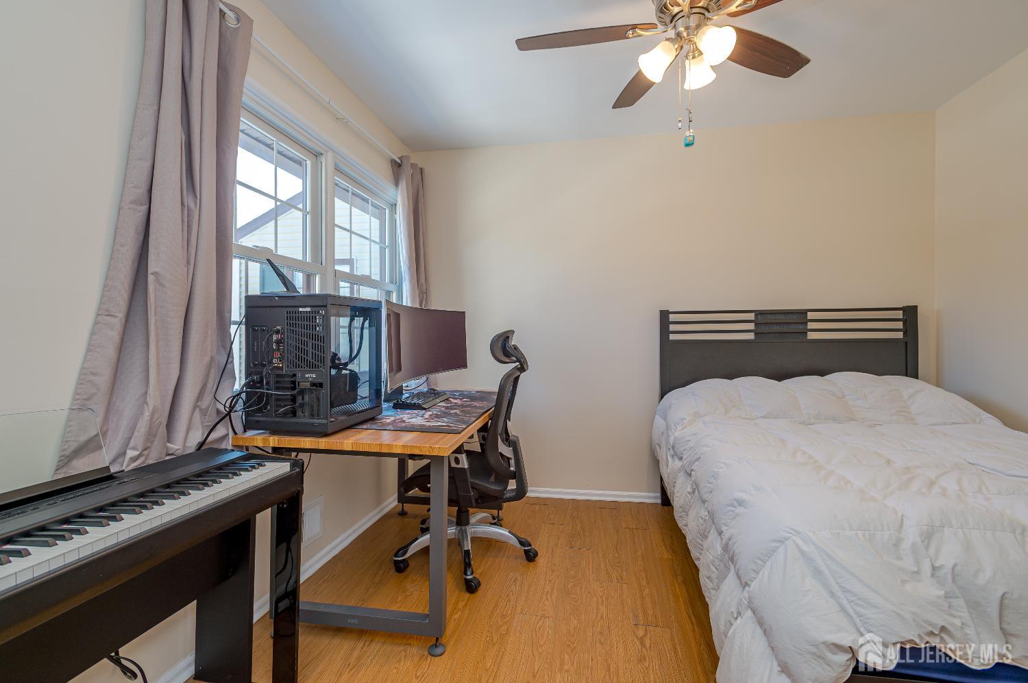 70-10 Prospect Street, Unit 10 Metuchen, NJ 08840 - Photo 15 of 20 a bedroom with a bed and a window