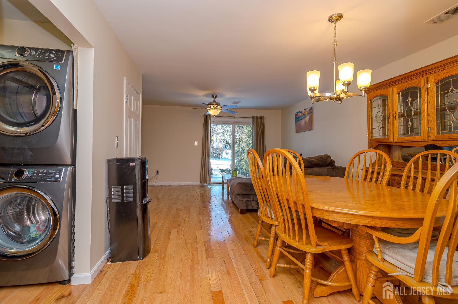 70-10 Prospect Street, Unit 10 Metuchen, NJ 08840 - Photo 4 of 20 a view of a dining room with furniture and chandelier