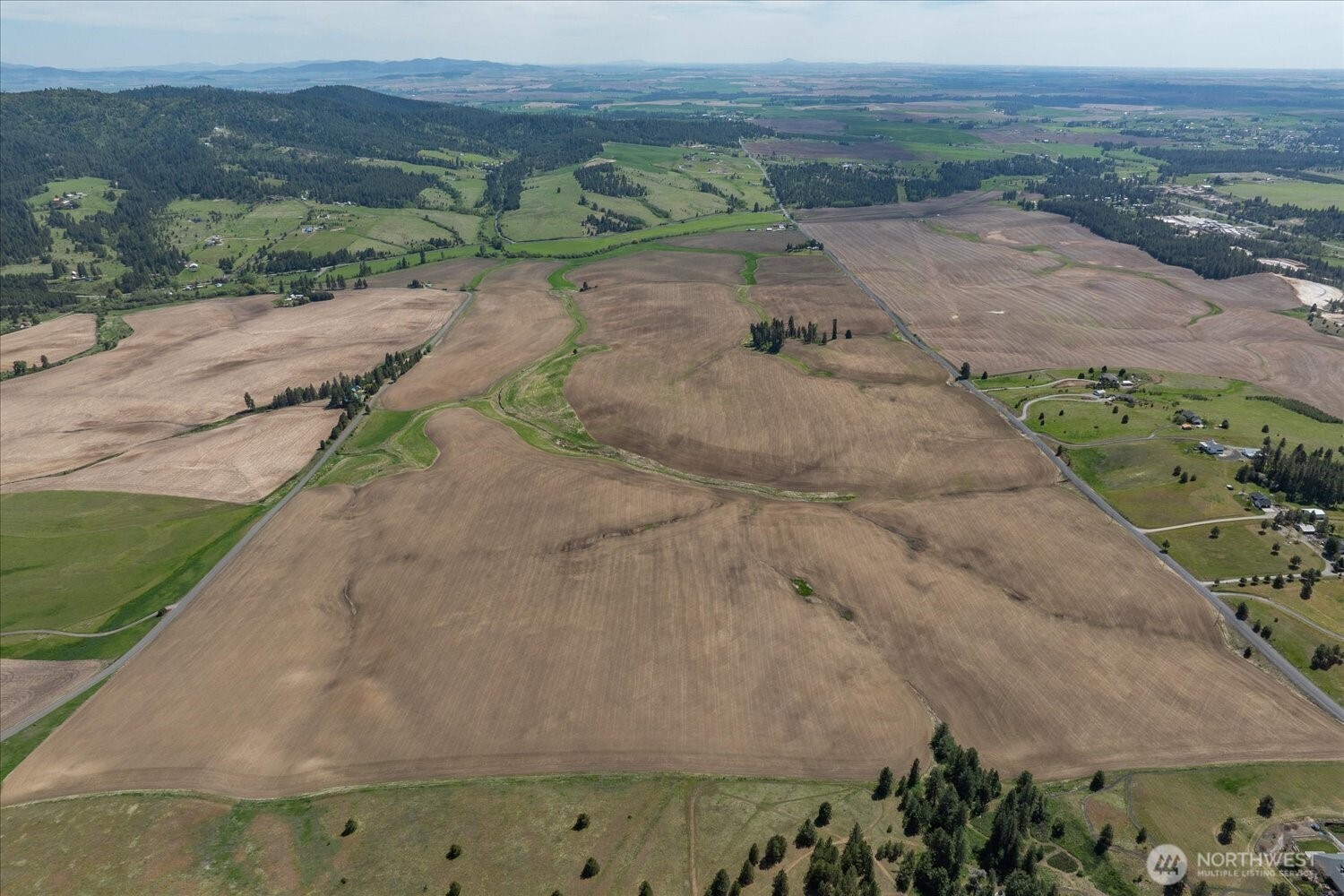 -xxx South Jackson Road, Unit LOT 17 Mica, WA 99023 - Photo 7 of 40 an aerial view of a yard