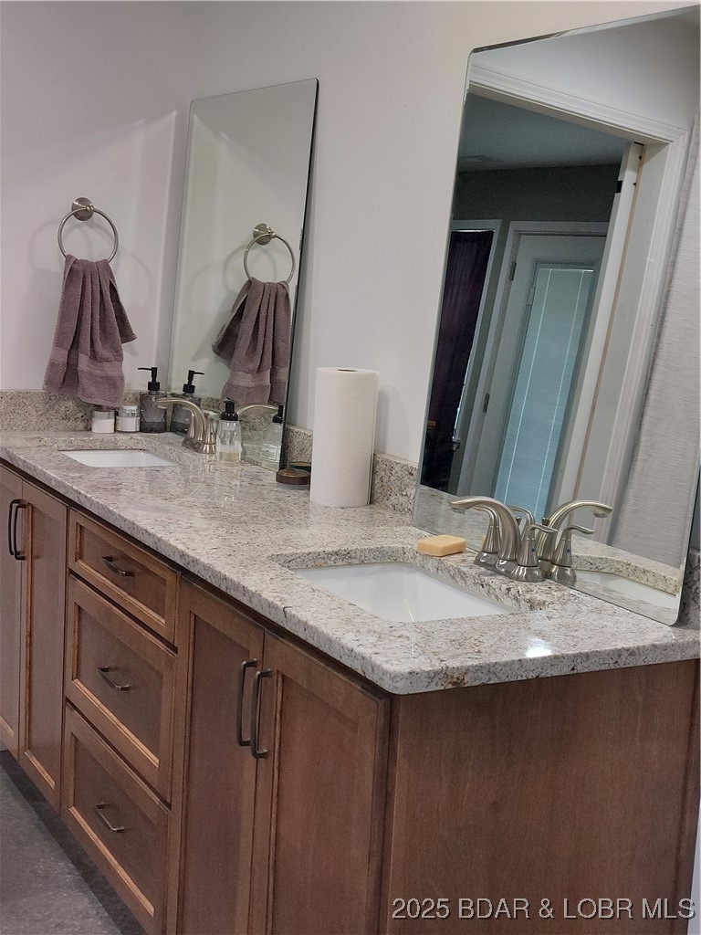6565-6567 Jay Bird Road Florence, MO 65329 - Photo 15 of 70 Double sinks, granite countertop in primary bathro