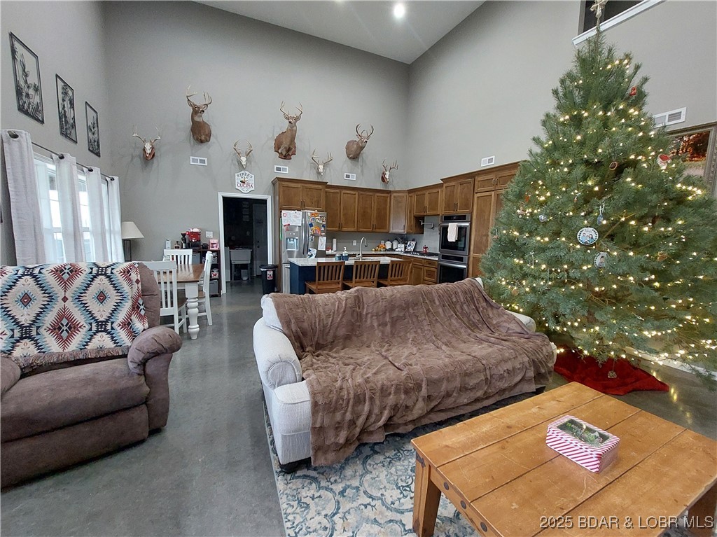 6565-6567 Jay Bird Road Florence, MO 65329 - Photo 6 of 70 Living room, dining area with vaulted ceilings! He