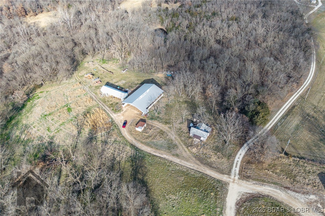 6565-6567 Jay Bird Road Florence, MO 65329 - Photo 65 of 70 Stack shed with machine shed on left. Old house on
